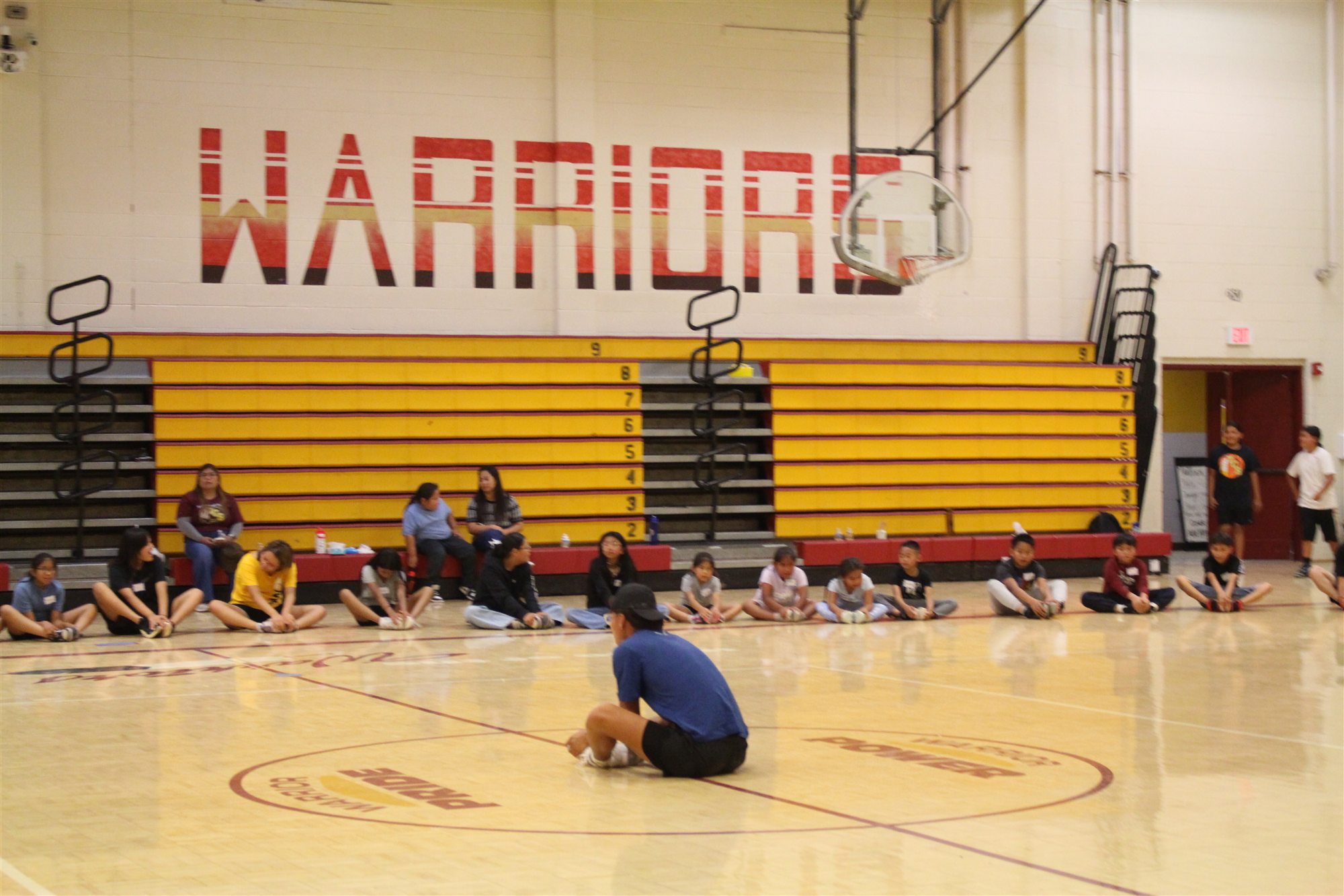 Native youth running together at a Wings youth program